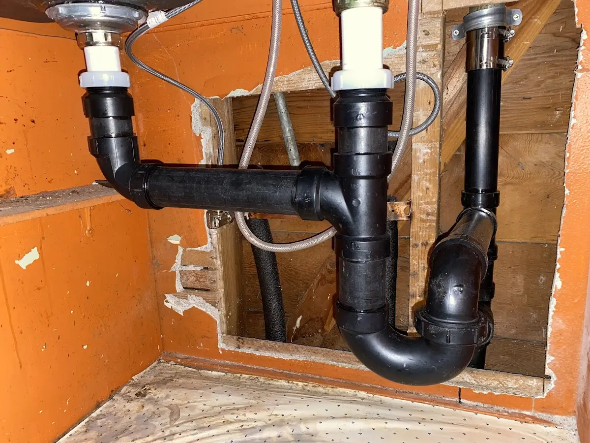 Professional Garbage Disposal Repair equipment and tools on the job in South Boston